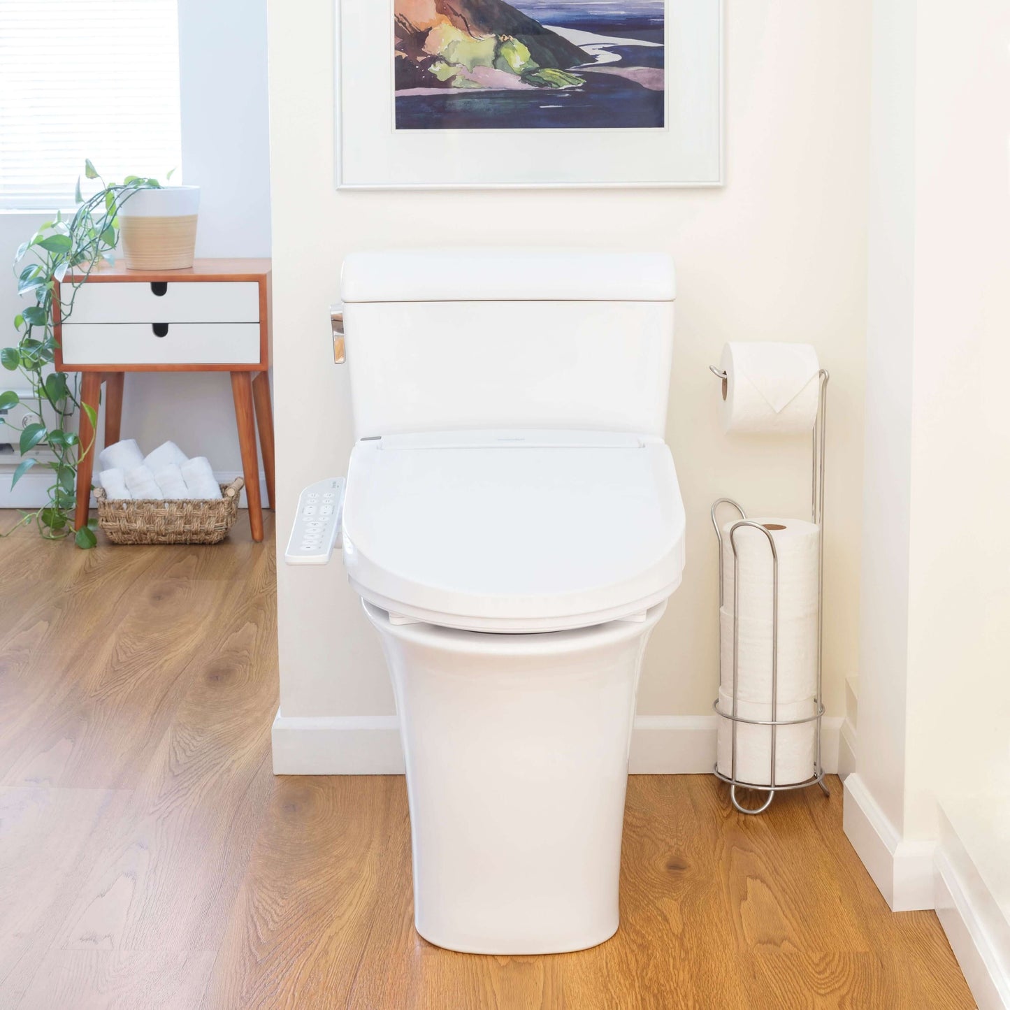 Swash Select DR801 Bidet Seat - front view attached to a toilet in a bathroom 
