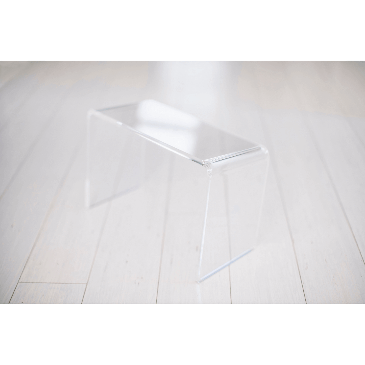 The PROPPR Acer - Clear Toilet Foot Stool - front view in a bathroom