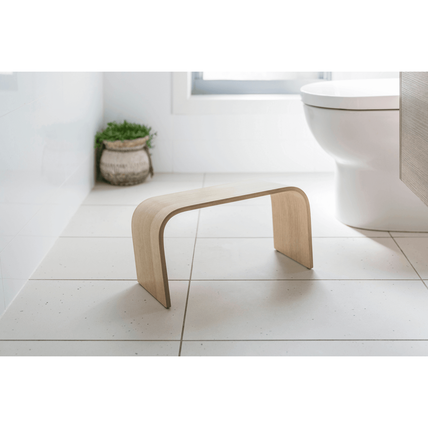 The PROPPR Timber - Tasmanian Oak Toilet Foot Stool - front view in a bathroom