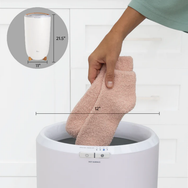 Luxury Towel Warmer - front view in a bathroom with woman pulling out socks