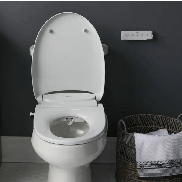Discovery DLS Bidet Seat - front view attached to a toilet in a bathroom with lid open