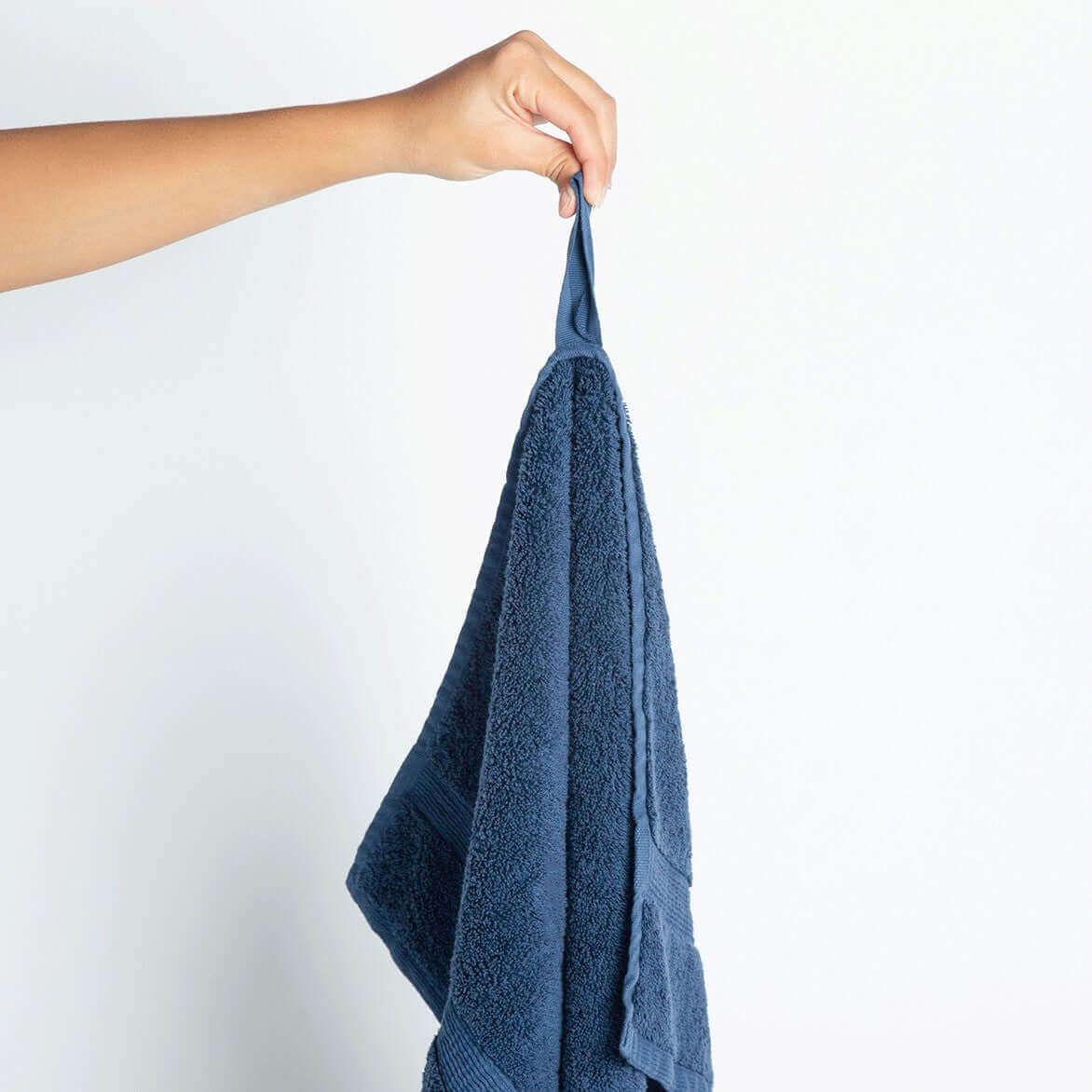 Nebia Hand Towel - front view of hand holding towel in color navy