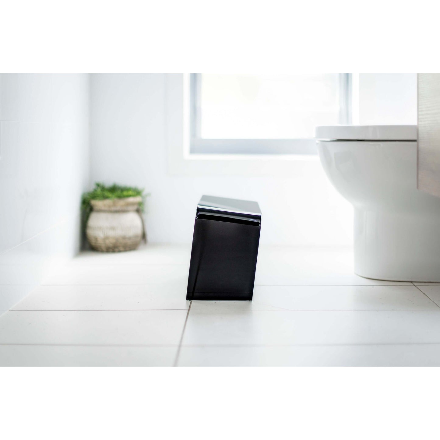 The PROPPR Acer - Black Toilet Foot Stool - side view in a bathroom