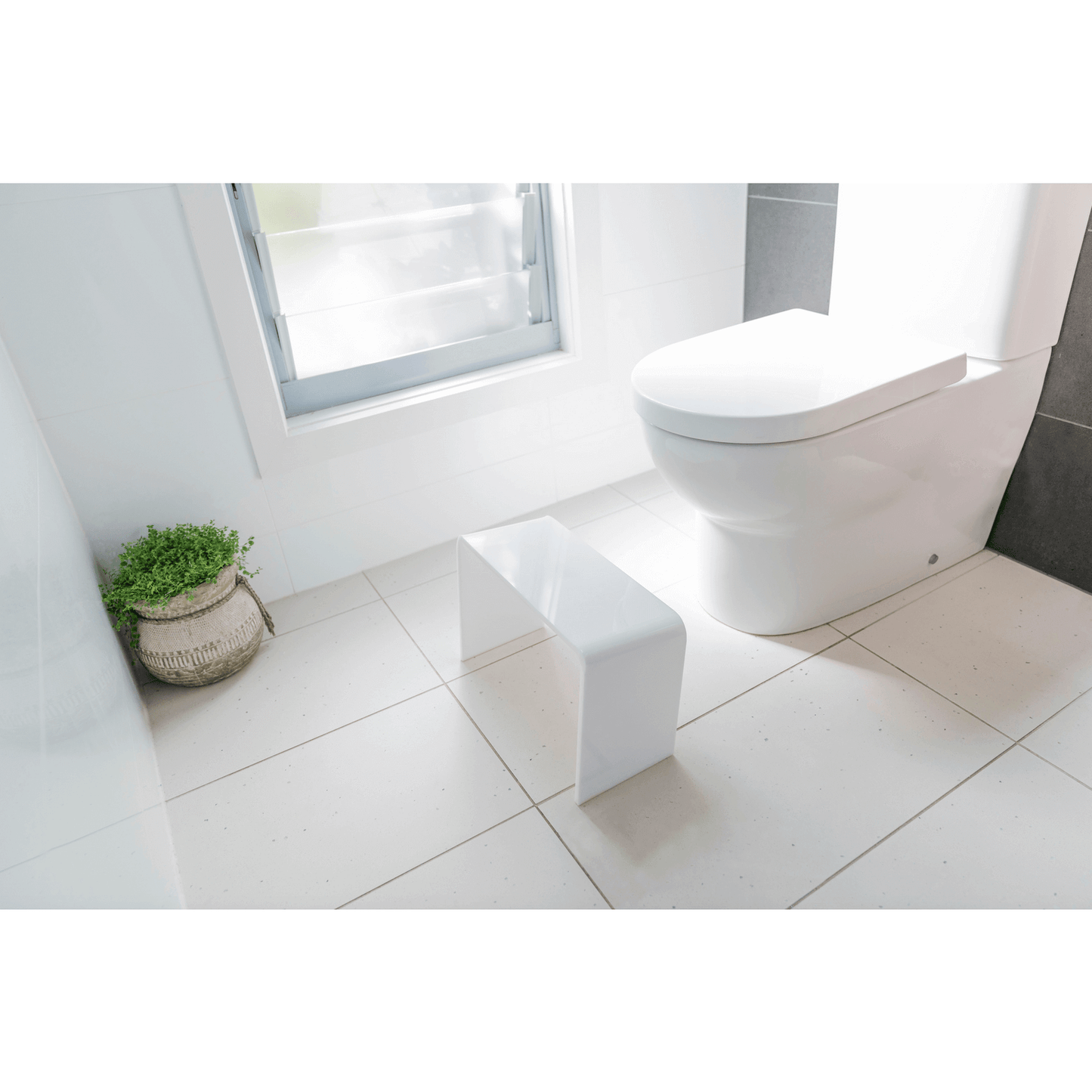 The PROPPR Acer - White Toilet Foot Stool - top angled view in a bathroom