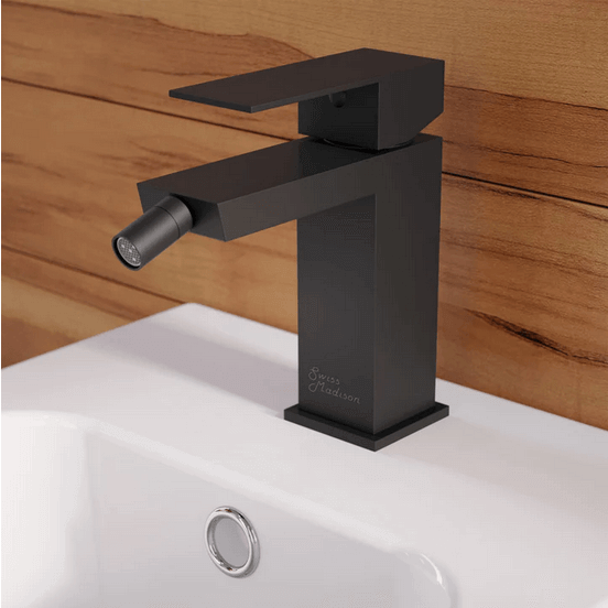 Concorde Bidet Faucet - side angled view in color black attached to a bidet in a bathroom