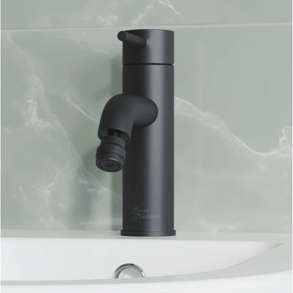 Ivy Bidet Faucet - front view in color black attached to a bidet in a bathroom