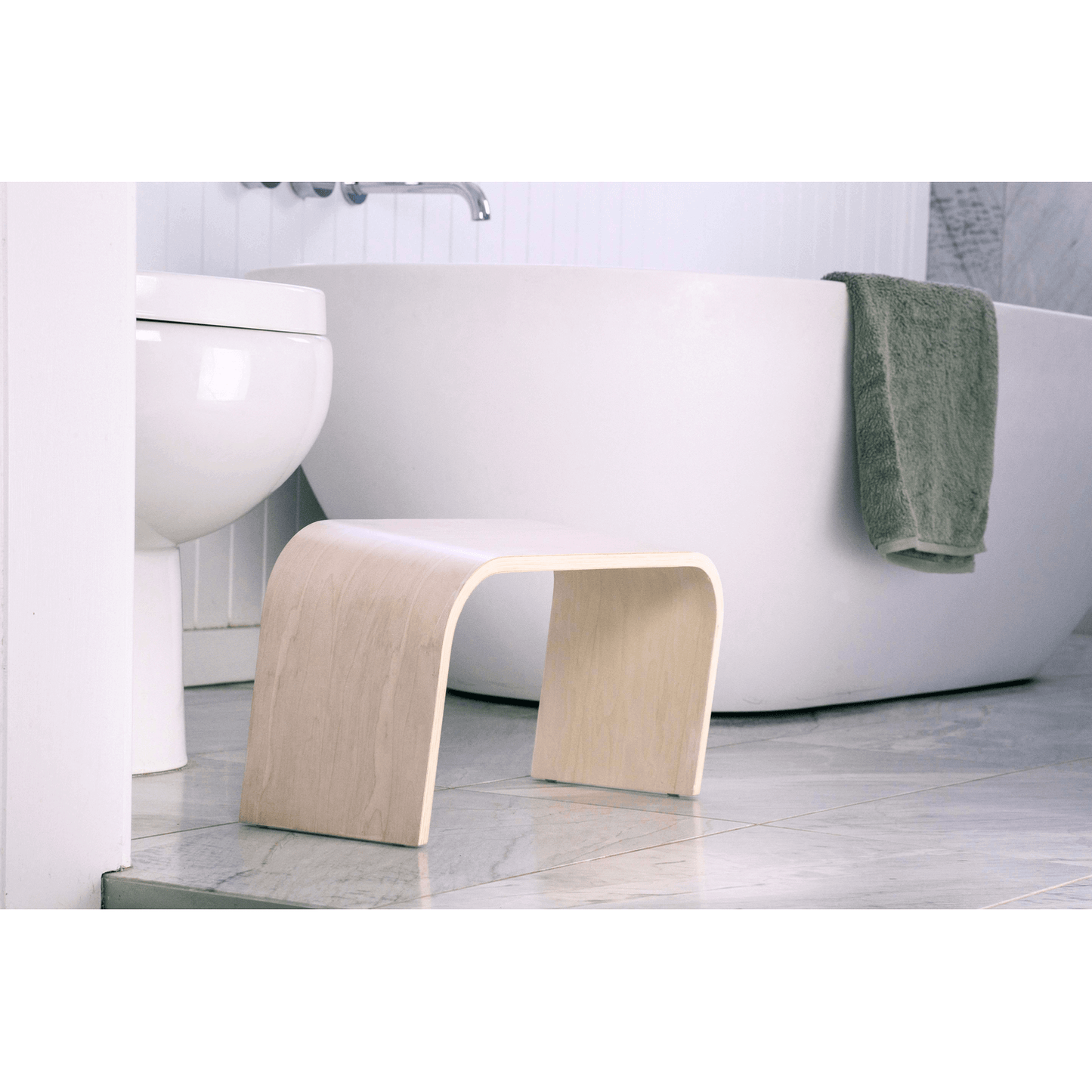 The PROPPR Timber - Whitewash Toilet Foot Stool - side angled view in a bathroom