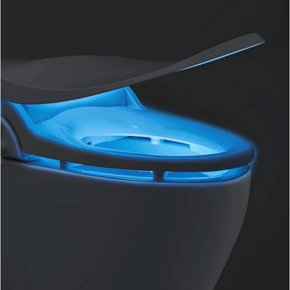 Slim Two Bidet Seat - side angled view attached to a toilet in darkness with nightlight illuminated