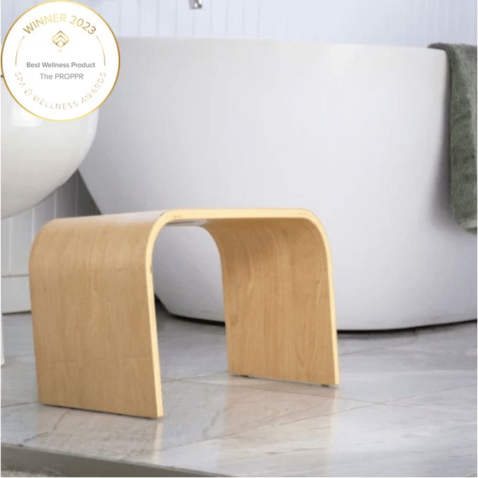 The Timber (Wooden) Maple Toilet Foot Stool - side angled view in a bathroom